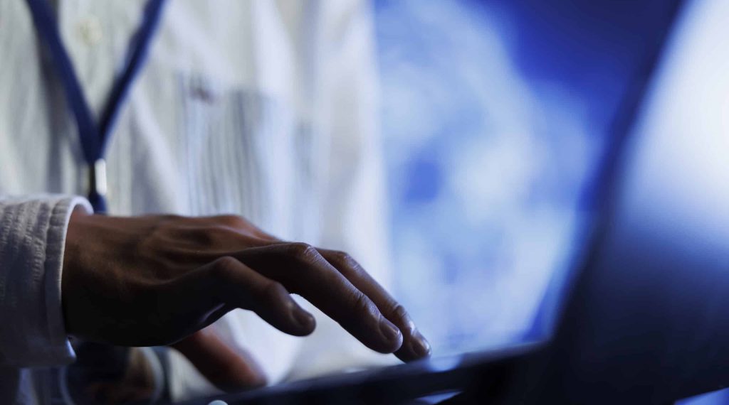Certified engineer writes code on laptop to visualize artificial intelligence neural networks using augmented reality technology, close up. Data center expert runs AI script for information processing