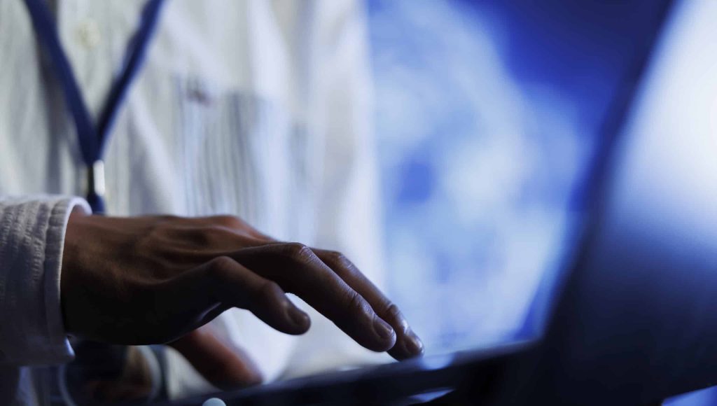 Certified engineer writes code on laptop to visualize artificial intelligence neural networks using augmented reality technology, close up. Data center expert runs AI script for information processing
