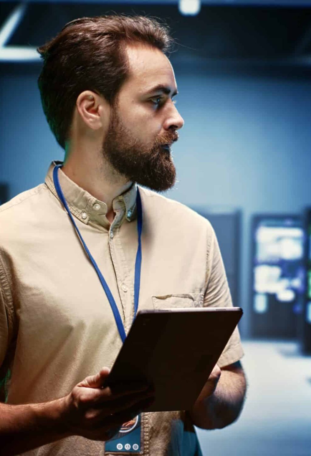 Supervisor doing routine inspection, extending high tech facility equipment life span and avoiding downtime. Manager checking data center infrastructure units for power fluctuations